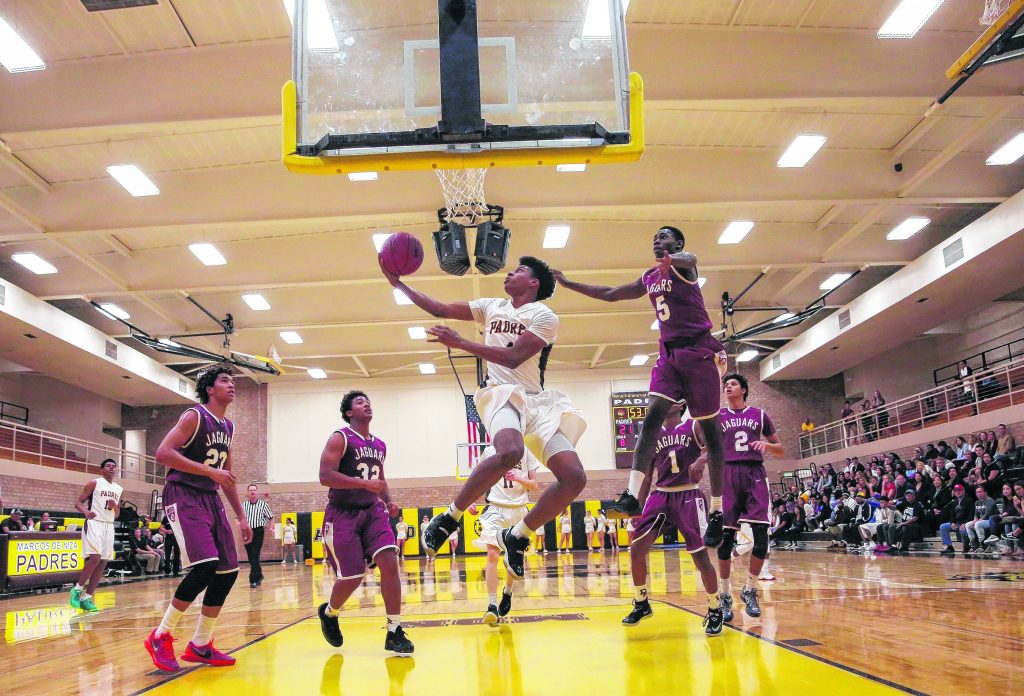 Marcos de Niza's Zurell Livingston (4) makes a shot during a basketball game against Desert Ridge in Tempe on Friday, December 11. Padres defeat Jaguars 61 to 56.  Wrangler News photo by Ana Ramirez. More photos can be found online at wn.calicoeng.com.