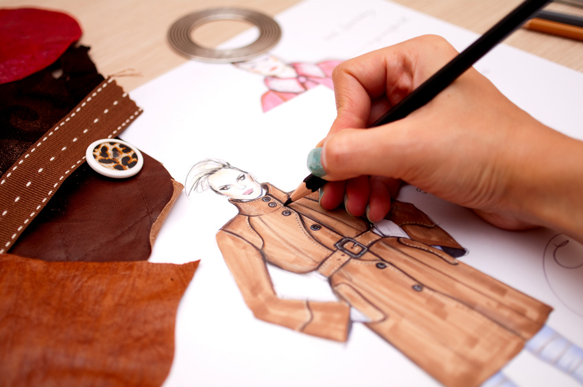 Fashion designer is drawing a fashion sketch for autumn-winter season