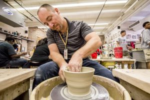 Fine arts instructor Jasen Evoy guided his Marcos de Niza High School ceramics students in a class project to create handmade bowls for the annual effort to generate funds for Tempe Community Action Agency. [Billy Hardiman/Wrangler News]