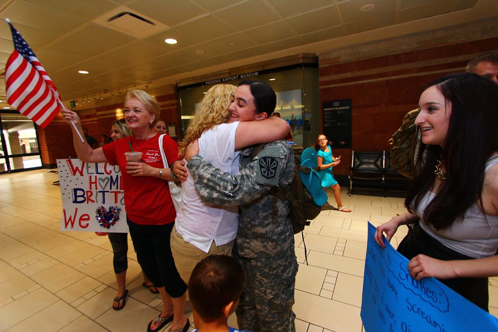 Family, friends and even strangers gave a heartfelt welcome to Arizona National Guard troops who arrived at Sky Harbor International Airport after nearly a year serving at Guantanamo Bay. 