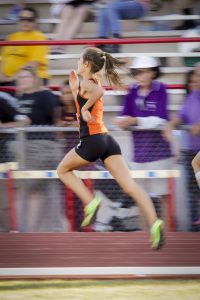 Jackie Martin starts off well earning second in the 100 meters at the Husky Invitational. [Billy Hardiman/Wrangler News]