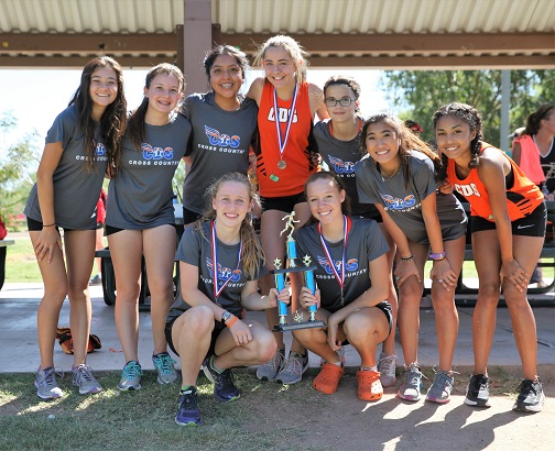 Corona’s girls cross country team took third place at the annual Ojo Rojo Invitational Cross Country meet. Team includes, front row, from left: Riley Wright, Renee Payne; top row: Kristina Phillips, Mia Da Rosa, Andelina Thomas, Mackenzie Burgess, Bella Sarno, Abby Cordiak, Cybelle Cozart. (Photo by Andy Wylde for Wrangler News)