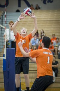 Chris Davis sets the ball during a match against Mesquite. [Billy Hardiman/Wrangler News]