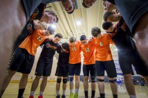 Aztecs gather in a pre-game prayer circle for their teammate. [Billy Hardiman/Wrangler News]